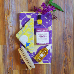 towels with soap, nail polish and yay for earth golden oil