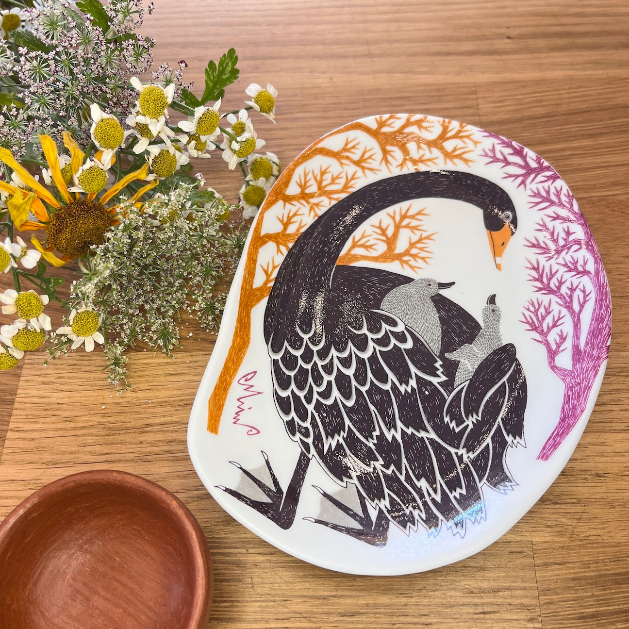 Small Bean Shaped plate with an image of a blackbird caring for her two babies.