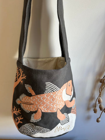 gray shoulder bag with fish 