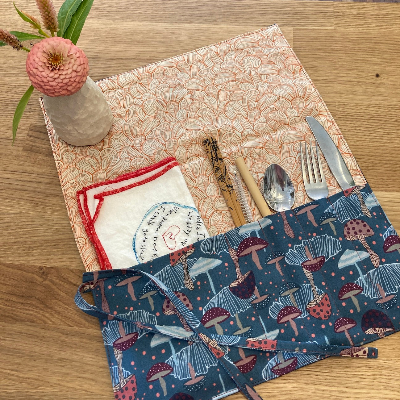 Fabric Cutlery Wrap Featuring navy mushroom pattern