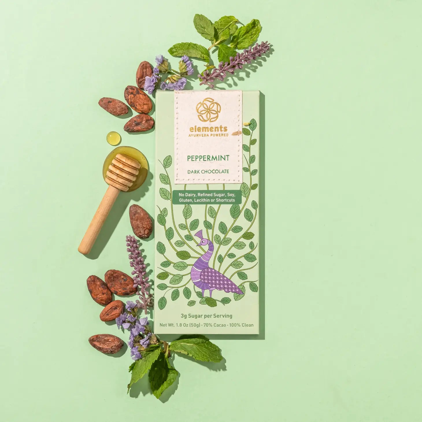 Green Package with a peacock on the front, mint and cocoa beans